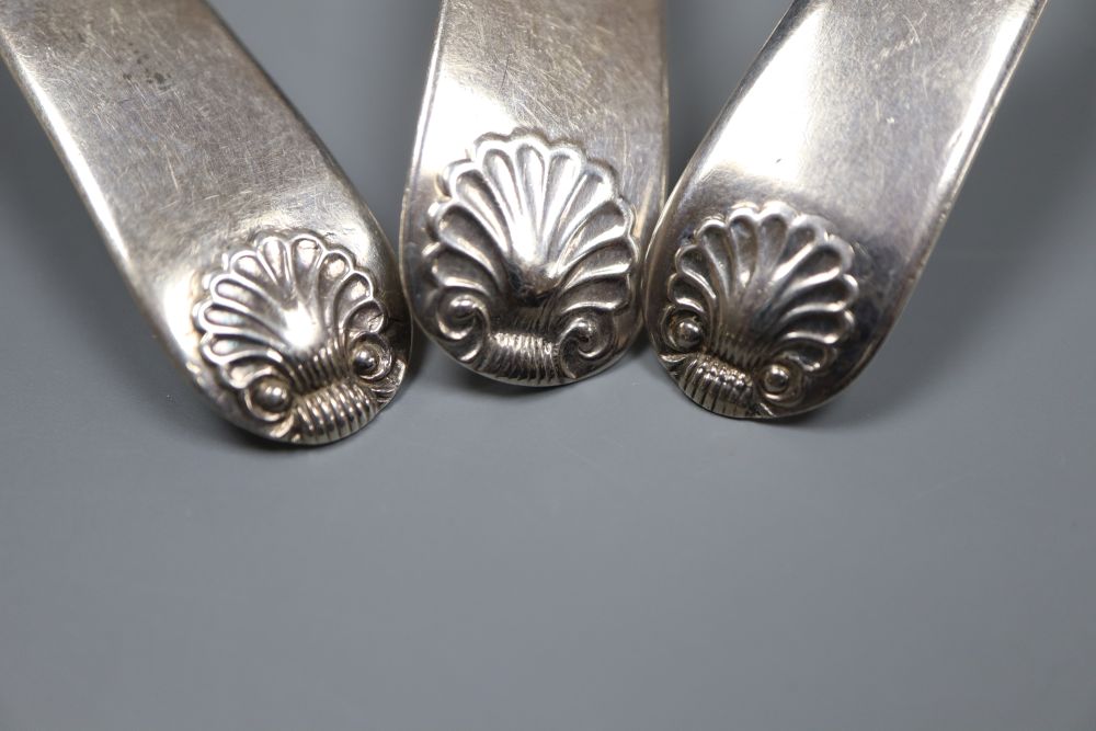 Three Scottish silver fiddle and shell pattern cream ladles, including a pair by John Zeigler, Edinburgh 1811.